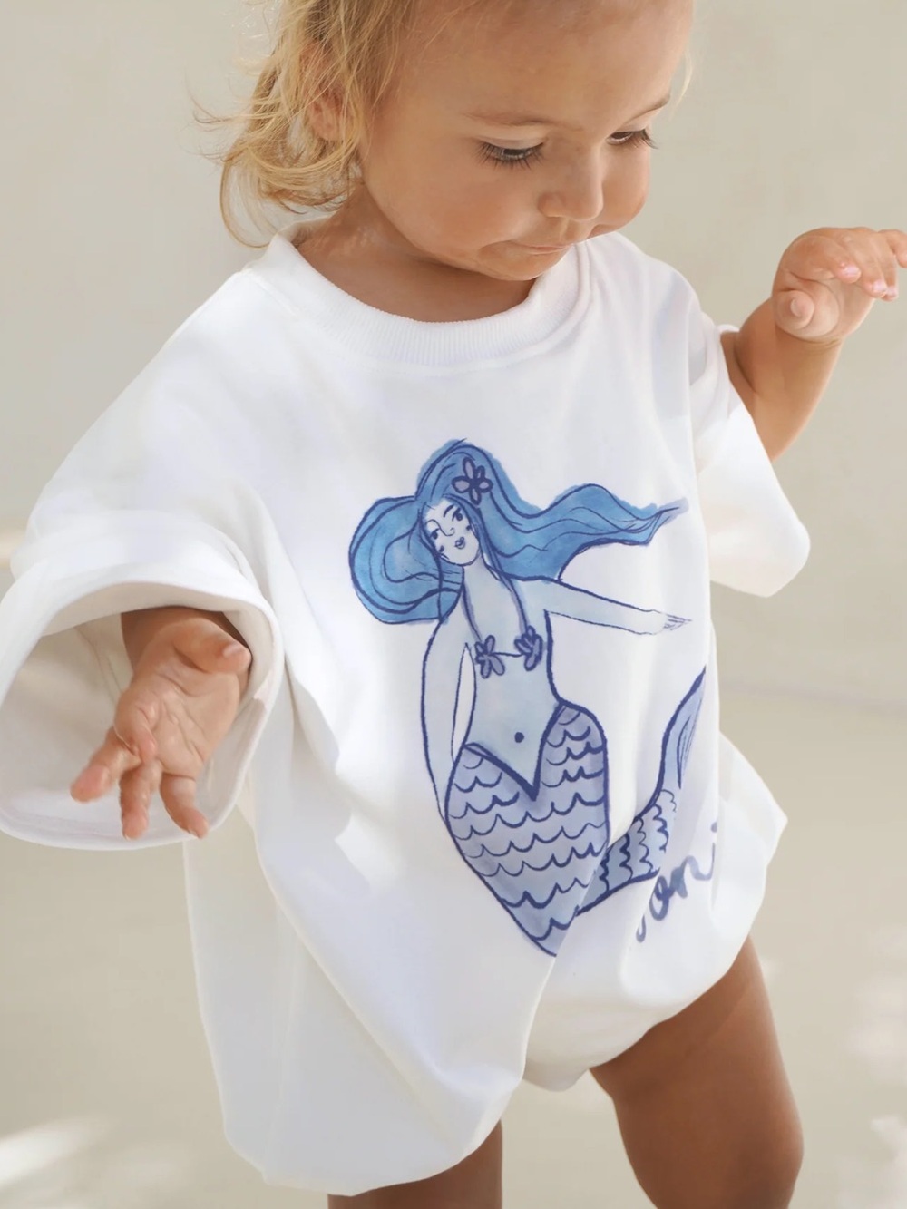 nomi White One-Piece with Blue Mermaid Graphic